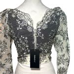 Elegant Floral Lace Blouse in Black and white Photo 1