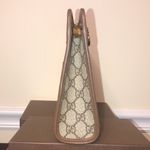 Gucci GG Supreme Clutch with Gold GG Zipper Pulls On Top Close and Front Pocket Photo 3