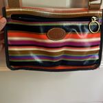 Fossil multicolor purse with adjustable strap in GUC. One small tear on bottom. Photo 3