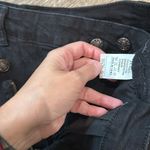 NWOT fashion black ripped jean shorts. Cross over Photo 2