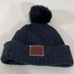 Love Your Melon Cuffed Beanie Hat in Navy Blue with Navy Blue Pom Brown Patch Photo 0