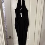 BCBGeneration  Black Jumpsuit with V-Neck and Defined Waist Photo 1