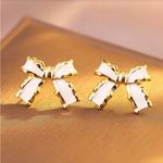 Elegant Gold and White Bow Earrings Photo 2