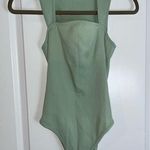 OQQ Women's 1 Piece Bodysuit Sexy Ribbed Strappy Square Neck Sleeveless Sz Large Green Photo 0