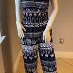 New Women’s dark Navy Blue jumpsuit size L/XL for size 14 New with tags Straps are adjustable Stretchy with front pockets Photo 0