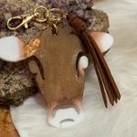 Handmade Handcrafted Brown and White Cow Keychain with Leather Tassel Photo 3
