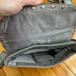 Gray studded faux leather cross body bag. Magnetic snaps on the front. Photo 7