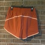 Stylish Women's Athletic Shorts in Rust by Nike Orange Size L Photo 1