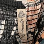 American Rag Black and Floral Jumpsuit with slits in legs Photo 4