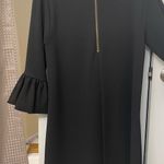Gorgeous black dress with puff sleeves. Size Medium. Zipper on back. Photo 1