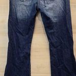 {29} KanCan Distressed Blue Jean Split Flare Hem Fringe Detail Photo 1