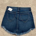 Free People We the Free Bailey blue denim mini skirt raw hem. Photo 2