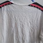 PINK Victoria's Secret tie up lace neckline pink on sleeves short sleeve shirt in white and black size large. Photo 11