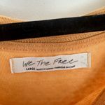 Free People We the Free Women’s Large Chill Out Orange Cold Shoulder Longsleeve Photo 1