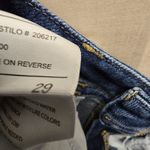 {29} KanCan Distressed Blue Jean Split Flare Hem Fringe Detail Photo 13