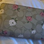 Coach  Corner Zip Wristlet in Signature Canvas with Heart Floral Print. Photo 0