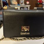 Bebe brand new Crossbody. The dimensions are 7 1/2 inches wide and 6 inches long Photo 5