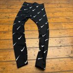 Nike  Women's Black All Over Swoosh Logo Leggings Pants Size Small Photo 3
