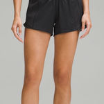 Lululemon  hotty hot 4 inch low rise black size 6 Photo 0