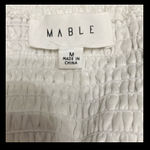 Mable  white Eyelet over the shoulder sleeve dress - Size Medium. *** Refer to measurements. Perfect Easter or spring dress... even graduation coming up.  Says Medium but sleeves extends for a heavy bustted top frame. Gently warn and excellent condition. Measurements approximately 15” from armpit to armpit x 32” long. None smoking home. Priced to sell at as is condition. Don’t like my price make reasonable offer. Photo 4