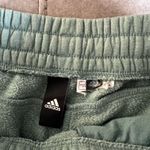 Adidas  women’s teal joggers Photo 3