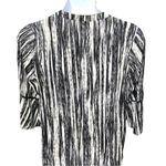 Gloria Vanderbilt Maurice’s cute black and white tunic with bell sleeves! New Photo 5
