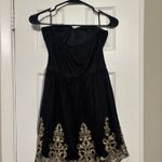 Dillard's Black and cold trim cocktail/hoco dress Photo 1