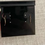 Dangling diamond and rose gold earrings Photo 1