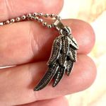 Silver tone half angel wing pendant necklace Photo 1