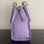 Trina Turk double handle tote in lilac with a removable crossbody strap Photo 5