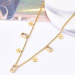 Dainty Clovers & CZ Charms Gold Necklace Photo 4