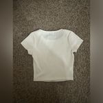 Princess Polly white cropped tshirt with a dragon, size 0 Photo 1