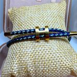 Braided in two shades of blue with gold Photo 1