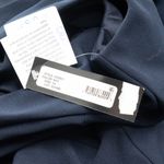 Betsy and Adam . Christine Scuba Crepe Ruffled Bow Gown. Photo 6