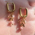 Gold hoop earrings with removable pink charms Photo 1