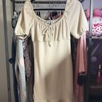 Almost Famous Cream Ruffle Hem Dress Photo 1