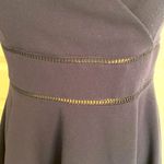 Jun & Ivy | Navy spaghetti strap sundress with embellishments at the waist. Photo 2