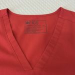 FIGS  deep coral V-Neck Scrub Top Photo 1