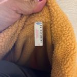 Free People Movement Free People Hit The Slopes cream and tan Sherpa snap jacket woman’s size S Photo 4