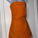 mable orange strapless romper medium Photo 1