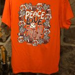 B. Jaxx Women’s Orange/Black Peace Love Football Tshirt Orange Size M Photo 1