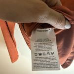 Nike Icon Clash all over logo print mock-neck long sleeve top in terracota Photo 4