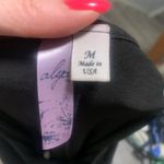 Alya  Oversized Flowy Black Top Photo 1