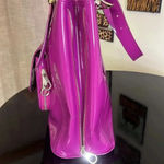 Ted Baker bag in beautiful purple. floral lining with snap closure Photo 4