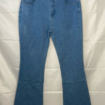EUC Women’s medium/light wash blue stretch flare leg distressed‎ hem jeans XL Photo 0