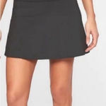 Athleta Ace Black Tennis Skort with silver reflective stripe on waistband Photo 0