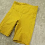 Athleta Ultimate Stash Pocket 7" Shorts Yellow Mustard High Rise Bike size XS Photo 1