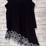 Kirkland Signature Elegant Black Floral Hem top with cold‎ shoulder embroidered flower shape cutout Photo 0