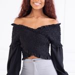 Ambiance Apparel NWOT Ambiance Black Criss Cross Smock bell Sleeve Top. Size Medium Photo 0