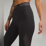 Lululemon  Logo Waistband High Rise Training Crop Graphite Grey Size 2  Pockets Photo 3